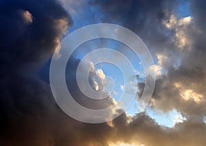 Beautiful orange sunset cloud formations on a deep blue sky