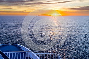 Beautiful Orange Sunset in the Ocean captured from a ferry deck between Denmark, and Faroe Islands