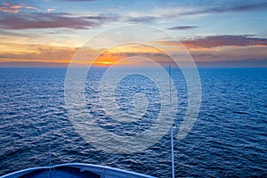 Beautiful Orange Sunset in the Ocean captured from a ferry deck between Denmark, and Faroe Islands