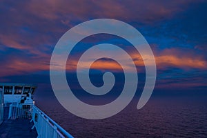 Beautiful Orange Sunset in the Ocean captured from a ferry deck between Denmark, and Faroe Islands