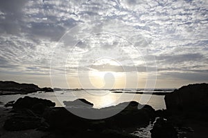 Beautiful orange sunset over the Black Sea. Evening sea with waves. Focusing in the center of the frame.