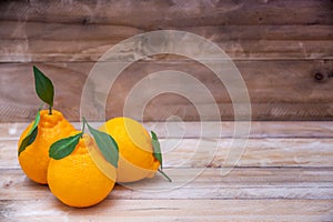 Beautiful Oranges Fruit on wooden table. rich with vitamins. background