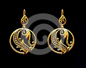 Beautiful Oriental gold Turkish jewelry women`s earrings black background