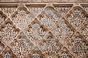 Beautiful ornate carving on the plastered walls in the courtyard