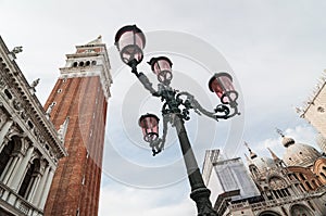 Beautiful ornate lampposts in Piazza San Marco against campanile