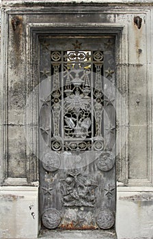Beautiful ornate tomb door in the Pere Lachaise cemetery. Paris
