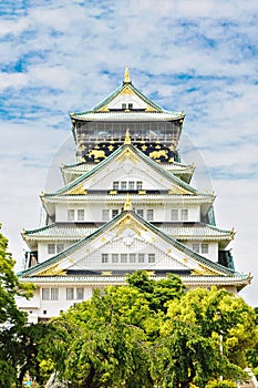 Beautiful Osaka castle in Japan on sunny summer day. Famous castle, attraction for tourists and sightseeing