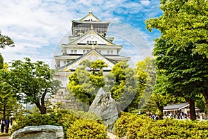 Beautiful Osaka castle in Japan on sunny summer day. Famous castle, attraction for tourists and sightseeing. Japanese