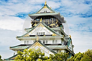 Beautiful Osaka castle in Japan on sunny summer day. Famous castle, attraction for tourists and sightseeing. Japanese