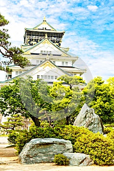 Beautiful Osaka castle in Japan on sunny summer day. Famous castle, attraction for tourists and sightseeing. Japanese