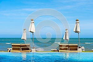 Beautiful outdoor nature landscape with bed deck chair around swimming pool in hotel resort