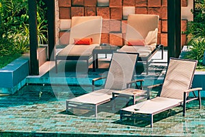 Beautiful outdoor swimming pool in hotel and resort with chair and deck for leisure vacation