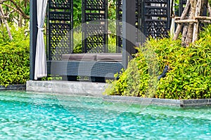 Beautiful outdoor swimming pool in hotel and resort with chair and deck for leisure vacation