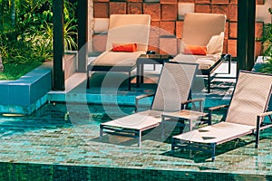 Beautiful outdoor swimming pool in hotel and resort with chair and deck for leisure vacation