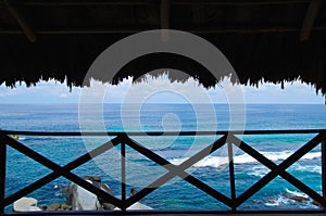 Beautiful outdoor view of a ocean seen from inside of a bungalow in Tairona National Park, Colombia photo