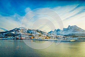 Beautiful outdoor view of some buildings in a coast on Hurtigruten voyage