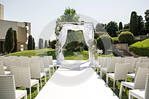 Beautiful outgoing wedding set up. Jewish Hupa  on romantic wedding ceremony , wedding outdoor on the lawn water view. Wedding