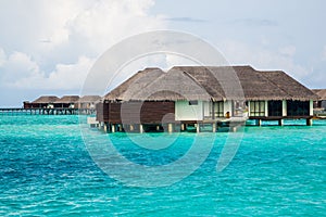 Beautiful overwater bungalows on the ocean in the Maldives Island