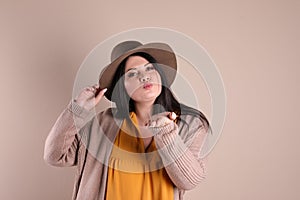 Beautiful overweight woman posing on background. Plus size model