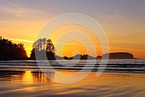 Tofino, Vancouver Island with Beautiful Pacific Sunset behind Frank Island at Chesterman Beach, British Columbia, Canada