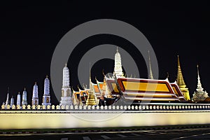 The beautiful pagodas stands majestically at night in Thai temple