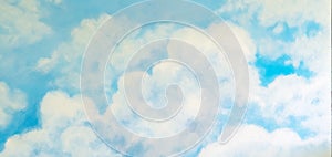 Beautiful painting of clouds and sky on cement wall. Scratched blue wall texturebackdrop surface. Concrete wall with clouds and