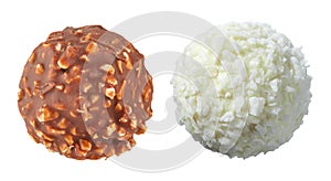 Beautiful pair of white and dark chocolate ball shaped candies with filling, nuts and coconut shavings isolated on white