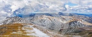 Beautiful panorama of Australian Alps under fluffy clouds