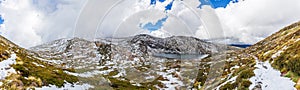 Beautiful Panorama of Blue Lake and snow covered mountains. Kosciuszko National Park, Australia photo