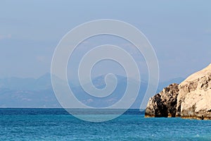 Beautiful panorama with clear turquoise water on a sunny day in the Ionian Sea , Kefalonia,Greece.