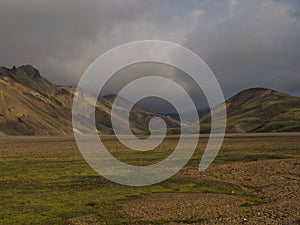 Beautiful panorama of colorful volcanic mountains in Landmannalaugar camp site area of Fjallabak Nature Reserve in