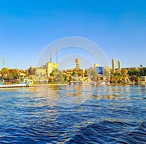 Beautiful panorama landscape with felucca boats on Nile river in Aswan at sunset
