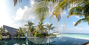 Beautiful panorama landscape of infinity pool at the tropical island resort