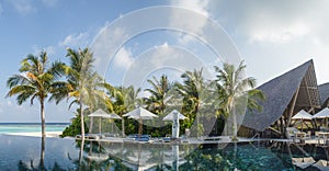 Beautiful panorama landscape view of infinity swimming pool at the tropical island luxury resort