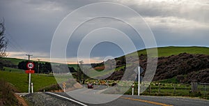 Beautiful panorama of a New Zealand road with a car taken on a cloudy winter day