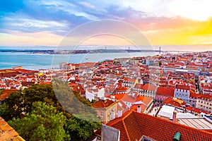 Beautiful panorama of old town Baixa district and Tagus River in Lisbon city during sunset, seen from Sao Jorge Castle