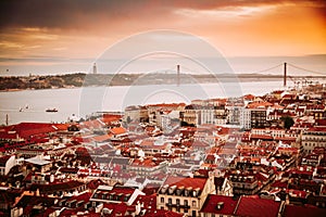 Beautiful panorama of old town Baixa district and Tagus River in Lisbon city during sunset, seen from Sao Jorge Castle