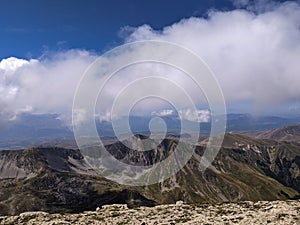 Beautiful panorama from the peak of Monte Corvo with blue sky and clouds in Abruzzo