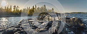 Beautiful panorama of a rocky  shore. Nordic sunrise or sunset.  Scenic view