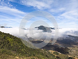 Beautiful Panorama Top view of growing golden paddy rice field in Tavan local village with fansipan mountain and cloudy sky in