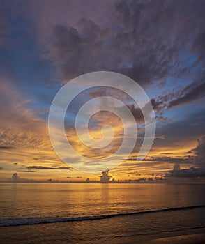 Beautiful of panorama vertical sunset over the clam sea with cloud sky background. Sunset over tropical beach. Nature summer