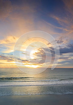 Beautiful of panorama vertical sunset over the clam sea with cloud sky background. Sunset over tropical beach. Nature summer