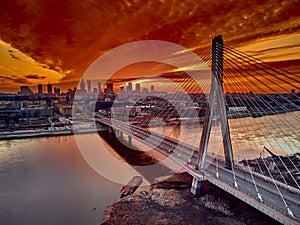 Beautiful panoramic aerial drone sunset view to Warsaw city center with skyscrapers and Swietokrzyski Bridge En: Holy Cross