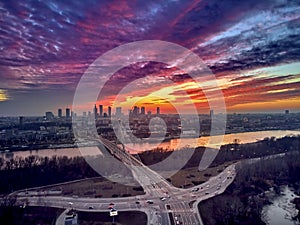 Beautiful panoramic aerial drone sunset view to Warsaw city center with skyscrapers and Swietokrzyski Bridge En: Holy Cross