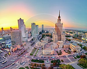Beautiful panoramic aerial drone view at sunset to the center of Warsaw City and Palace of Culture and Science - a notable high-