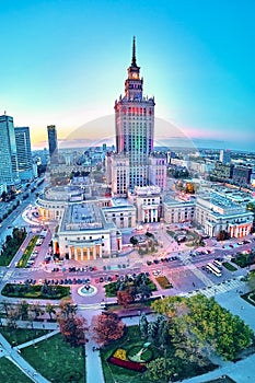 Beautiful panoramic aerial drone view at sunset to the center of Warsaw City and Palace of Culture and Science - a notable high-