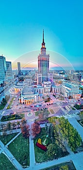 Beautiful panoramic aerial drone view at sunset to the center of Warsaw City and Palace of Culture and Science - a notable high-