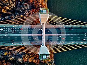 Beautiful panoramic aerial drone view to cable-stayed Siekierkowski Bridge over the Vistula river and Warsaw City skyscrapers,