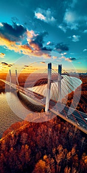 Beautiful panoramic aerial drone view to cable-stayed Siekierkowski Bridge over the Vistula river and Warsaw City skyscrapers,