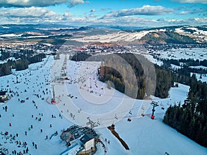 Beautiful panoramic aerial drone view to the ski slopes with lifts in the Bialka Tatrzanska ski resort Tatra Mountains Tatras,